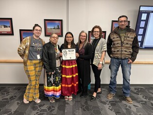 (LEFT TO RIGHT) WCPS Cultural Support Worker Tara Peninou, Elder Effie Janvier, student Chloe Sanderson, WCPS Board Chair Luci Henry, WCPS Director of Indigenous Education and Reconciliation Erin Tisdale, and Dion Yellowbird stand together for a photo aft